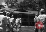 Image of Japanese teach semaphore signaling to Borneo natives Borneo, 1942, second 30 stock footage video 65675050779