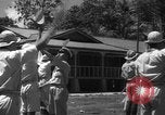 Image of Japanese teach semaphore signaling to Borneo natives Borneo, 1942, second 31 stock footage video 65675050779
