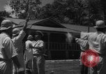 Image of Japanese teach semaphore signaling to Borneo natives Borneo, 1942, second 33 stock footage video 65675050779