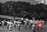 Image of Japanese teach semaphore signaling to Borneo natives Borneo, 1942, second 35 stock footage video 65675050779