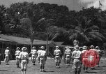 Image of Japanese teach semaphore signaling to Borneo natives Borneo, 1942, second 38 stock footage video 65675050779