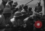 Image of Japanese teach semaphore signaling to Borneo natives Borneo, 1942, second 50 stock footage video 65675050779
