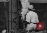 Image of Japanese teach semaphore signaling to Borneo natives Borneo, 1942, second 62 stock footage video 65675050779
