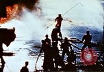 Image of Japanese Kamikaze aircraft hits USS Lexington Pacific Ocean, 1944, second 20 stock footage video 65675050812