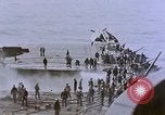 Image of USS Enterprise severely damaged by Kamikaze strike Pacific Ocean, 1945, second 55 stock footage video 65675050835