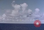 Image of U.S. Navy TBF Avenger aircraft drop practice bombs on target sled Pacific Ocean, 1945, second 6 stock footage video 65675050838