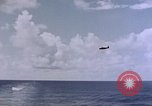 Image of U.S. Navy TBF Avenger aircraft drop practice bombs on target sled Pacific Ocean, 1945, second 13 stock footage video 65675050838