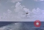 Image of U.S. Navy TBF Avenger aircraft drop practice bombs on target sled Pacific Ocean, 1945, second 14 stock footage video 65675050838