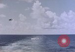 Image of U.S. Navy TBF Avenger aircraft drop practice bombs on target sled Pacific Ocean, 1945, second 16 stock footage video 65675050838