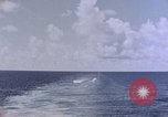 Image of U.S. Navy TBF Avenger aircraft drop practice bombs on target sled Pacific Ocean, 1945, second 18 stock footage video 65675050838