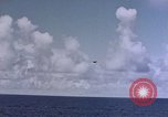 Image of U.S. Navy TBF Avenger aircraft drop practice bombs on target sled Pacific Ocean, 1945, second 27 stock footage video 65675050838