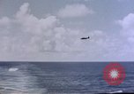 Image of U.S. Navy TBF Avenger aircraft drop practice bombs on target sled Pacific Ocean, 1945, second 37 stock footage video 65675050838