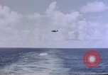 Image of U.S. Navy TBF Avenger aircraft drop practice bombs on target sled Pacific Ocean, 1945, second 38 stock footage video 65675050838