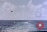 Image of U.S. Navy TBF Avenger aircraft drop practice bombs on target sled Pacific Ocean, 1945, second 39 stock footage video 65675050838