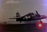 Image of F6F Hellcat aircraft on fire Pacific Ocean, 1945, second 3 stock footage video 65675050861