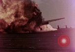 Image of F6F Hellcat aircraft on fire Pacific Ocean, 1945, second 7 stock footage video 65675050861