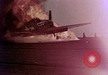Image of F6F Hellcat aircraft on fire Pacific Ocean, 1945, second 8 stock footage video 65675050861