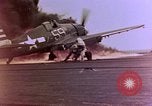 Image of F6F Hellcat aircraft on fire Pacific Ocean, 1945, second 10 stock footage video 65675050861