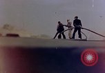 Image of F6F Hellcat aircraft on fire Pacific Ocean, 1945, second 14 stock footage video 65675050861