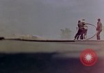 Image of F6F Hellcat aircraft on fire Pacific Ocean, 1945, second 22 stock footage video 65675050861