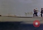 Image of F6F Hellcat aircraft on fire Pacific Ocean, 1945, second 23 stock footage video 65675050861