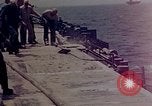 Image of F6F Hellcat aircraft on fire Pacific Ocean, 1945, second 38 stock footage video 65675050861