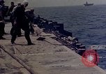 Image of F6F Hellcat aircraft on fire Pacific Ocean, 1945, second 39 stock footage video 65675050861