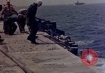 Image of F6F Hellcat aircraft on fire Pacific Ocean, 1945, second 40 stock footage video 65675050861