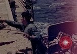 Image of F6F Hellcat aircraft on fire Pacific Ocean, 1945, second 42 stock footage video 65675050861
