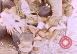 Image of American infantry searching hideouts on Saipan for Japanese soldiers Saipan Northern Mariana Islands, 1944, second 32 stock footage video 65675050872