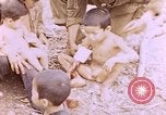 Image of American infantry searching hideouts on Saipan for Japanese soldiers Saipan Northern Mariana Islands, 1944, second 33 stock footage video 65675050872