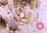 Image of American infantry searching hideouts on Saipan for Japanese soldiers Saipan Northern Mariana Islands, 1944, second 34 stock footage video 65675050872