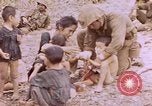 Image of American infantry searching hideouts on Saipan for Japanese soldiers Saipan Northern Mariana Islands, 1944, second 36 stock footage video 65675050872