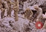 Image of American infantry searching hideouts on Saipan for Japanese soldiers Saipan Northern Mariana Islands, 1944, second 43 stock footage video 65675050872