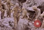 Image of American infantry searching hideouts on Saipan for Japanese soldiers Saipan Northern Mariana Islands, 1944, second 46 stock footage video 65675050872