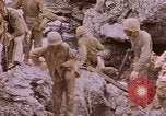Image of American infantry searching hideouts on Saipan for Japanese soldiers Saipan Northern Mariana Islands, 1944, second 47 stock footage video 65675050872