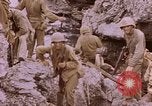Image of American infantry searching hideouts on Saipan for Japanese soldiers Saipan Northern Mariana Islands, 1944, second 48 stock footage video 65675050872