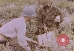 Image of American infantry searching hideouts on Saipan for Japanese soldiers Saipan Northern Mariana Islands, 1944, second 58 stock footage video 65675050872