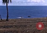 Image of American soldiers search a Japanese youth in uniform Saipan Northern Mariana Islands, 1944, second 7 stock footage video 65675050873