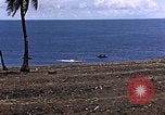 Image of American soldiers search a Japanese youth in uniform Saipan Northern Mariana Islands, 1944, second 8 stock footage video 65675050873