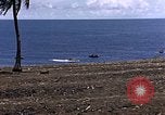 Image of American soldiers search a Japanese youth in uniform Saipan Northern Mariana Islands, 1944, second 9 stock footage video 65675050873