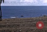Image of American soldiers search a Japanese youth in uniform Saipan Northern Mariana Islands, 1944, second 10 stock footage video 65675050873