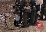 Image of American soldiers search a Japanese youth in uniform Saipan Northern Mariana Islands, 1944, second 13 stock footage video 65675050873