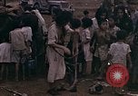 Image of American soldiers search a Japanese youth in uniform Saipan Northern Mariana Islands, 1944, second 27 stock footage video 65675050873