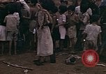Image of American soldiers search a Japanese youth in uniform Saipan Northern Mariana Islands, 1944, second 28 stock footage video 65675050873