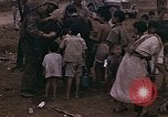 Image of American soldiers search a Japanese youth in uniform Saipan Northern Mariana Islands, 1944, second 29 stock footage video 65675050873