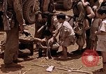 Image of American soldiers search a Japanese youth in uniform Saipan Northern Mariana Islands, 1944, second 33 stock footage video 65675050873