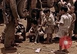 Image of American soldiers search a Japanese youth in uniform Saipan Northern Mariana Islands, 1944, second 35 stock footage video 65675050873