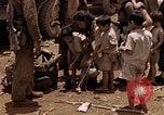 Image of American soldiers search a Japanese youth in uniform Saipan Northern Mariana Islands, 1944, second 36 stock footage video 65675050873