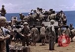 Image of American soldiers search a Japanese youth in uniform Saipan Northern Mariana Islands, 1944, second 38 stock footage video 65675050873